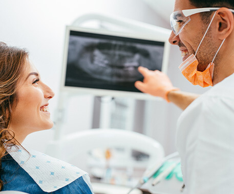 dentist reviewing an x-ray with a patient