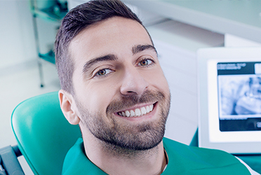 man at the dentist for oral cancer screening